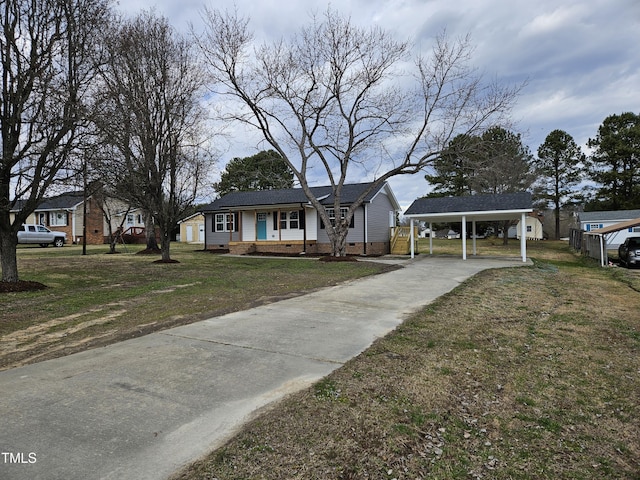 view of front of home featuring a carport, crawl space, and a front yard