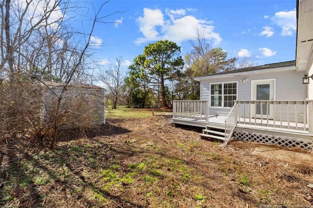 view of yard featuring a deck