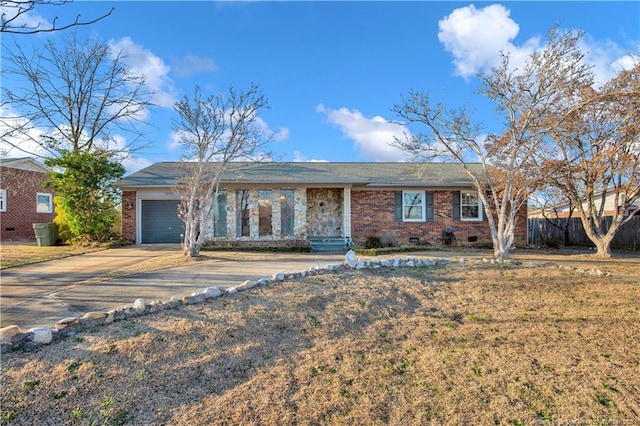 single story home with crawl space, driveway, a garage, and brick siding