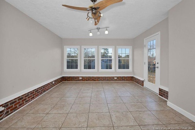 interior space featuring ceiling fan