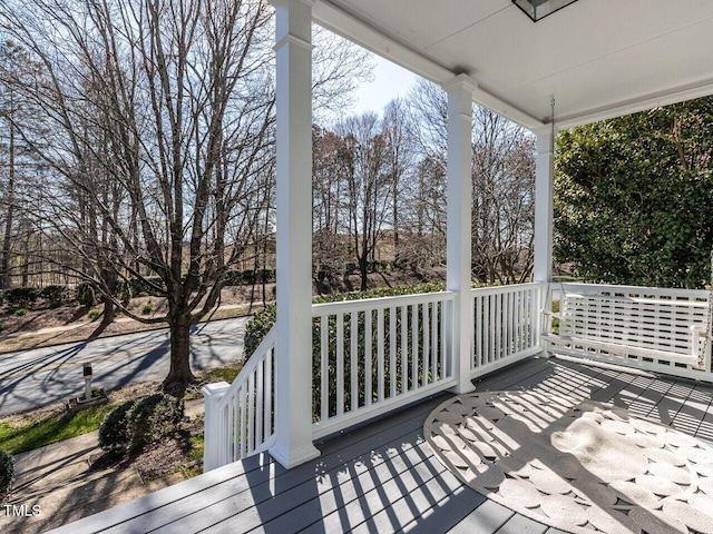 wooden terrace featuring a porch