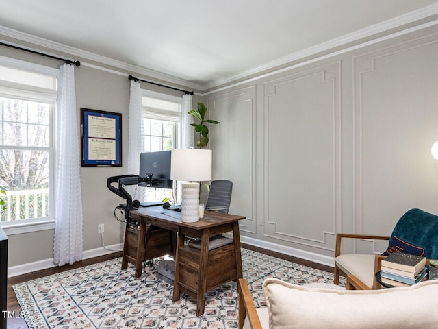 office with crown molding, wood finished floors, baseboards, and a wealth of natural light