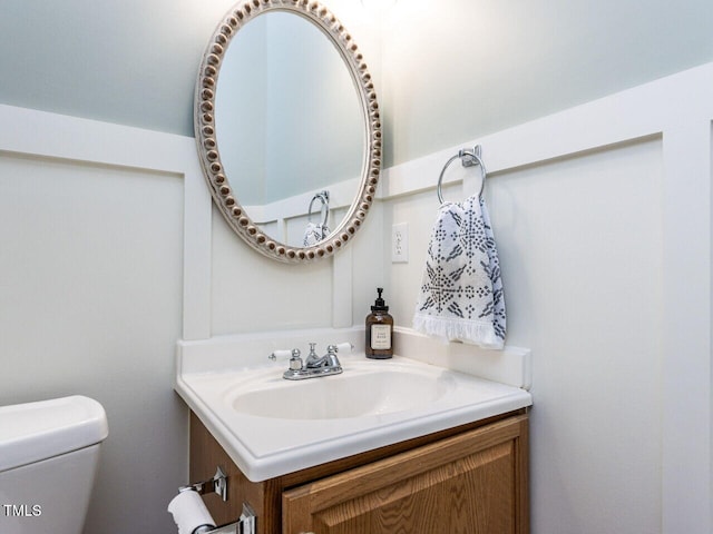 bathroom with vanity and toilet