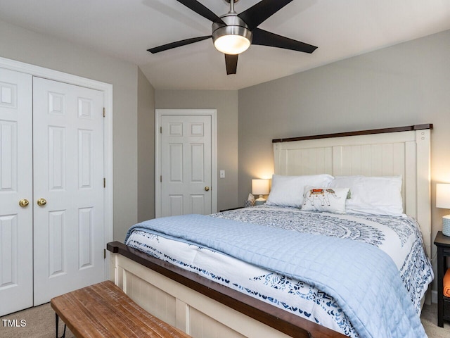 bedroom with a closet, ceiling fan, and carpet flooring