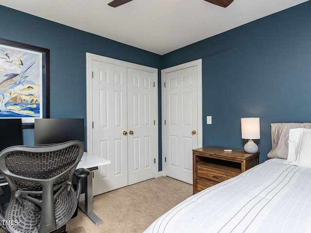 carpeted bedroom with a closet and ceiling fan