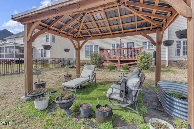 view of yard with fence and a gazebo