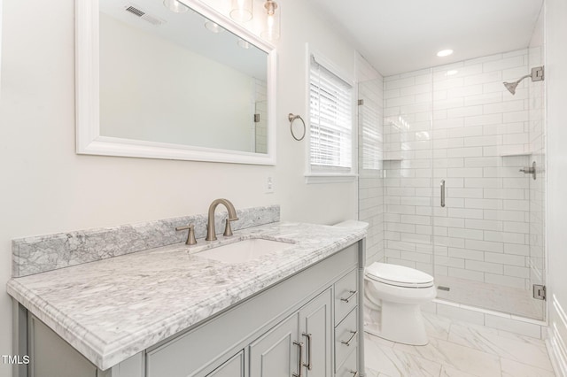 full bath with visible vents, toilet, marble finish floor, a shower stall, and vanity