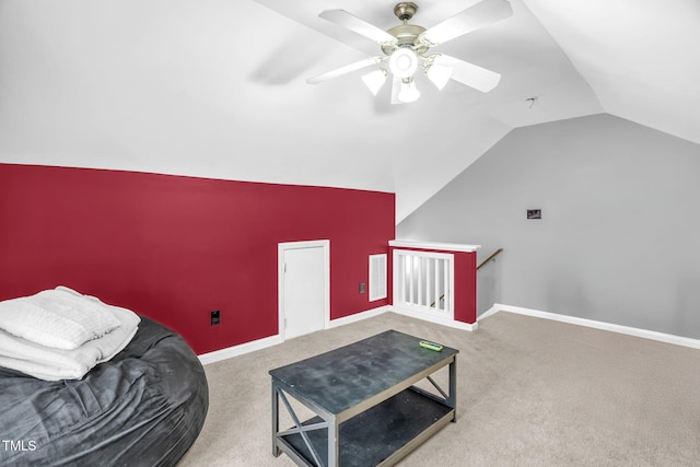 interior space featuring visible vents, baseboards, carpet, vaulted ceiling, and an upstairs landing