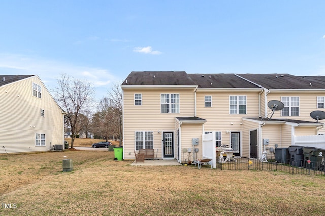 back of house featuring a yard, fence, central AC, and a patio