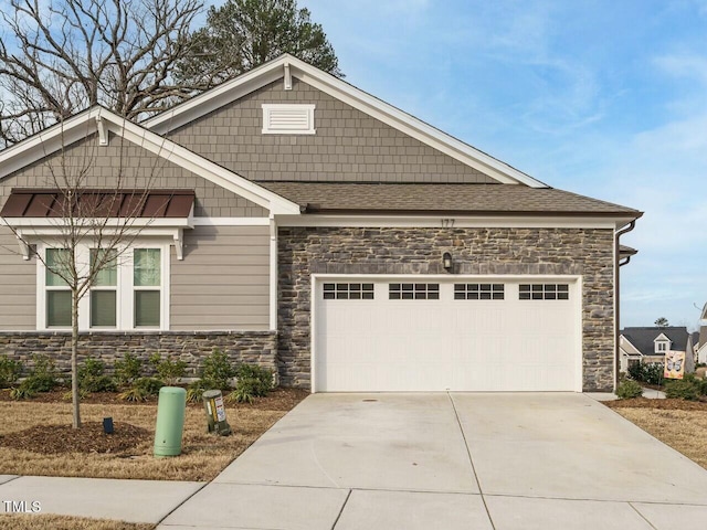 craftsman house with stone siding, concrete driveway, a garage, and roof with shingles