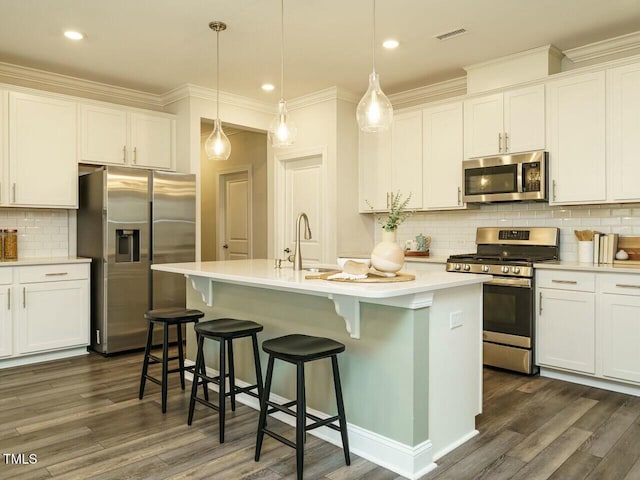 kitchen with dark wood-style floors, visible vents, appliances with stainless steel finishes, and a sink