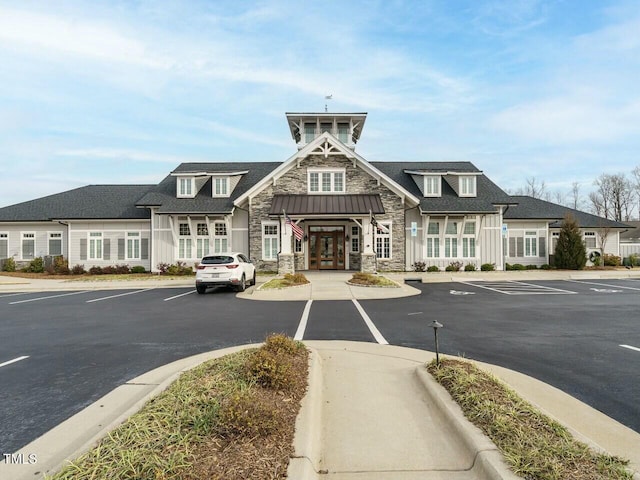 view of property featuring uncovered parking