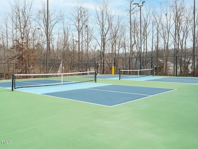 view of sport court with community basketball court and fence