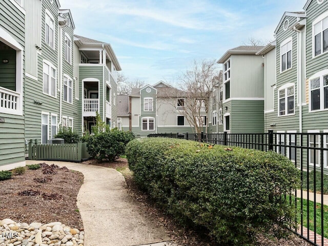 view of community featuring a residential view and fence