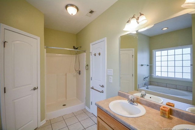 bathroom with double vanity, tile patterned flooring, a sink, and visible vents