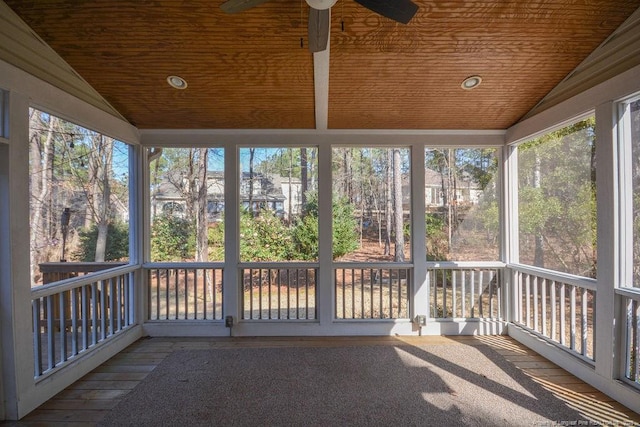 unfurnished sunroom featuring wooden ceiling, vaulted ceiling, and ceiling fan