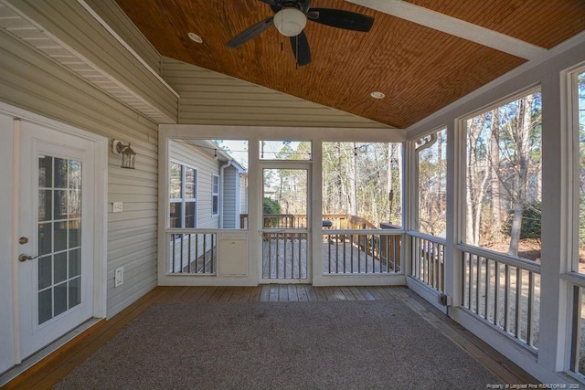 unfurnished sunroom with lofted ceiling, plenty of natural light, and wood ceiling