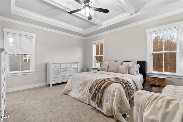 bedroom featuring light carpet, multiple windows, baseboards, and beamed ceiling