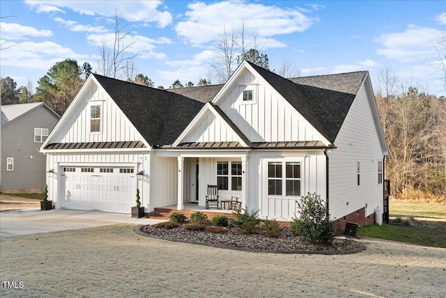 modern farmhouse style home with a porch, a standing seam roof, and board and batten siding