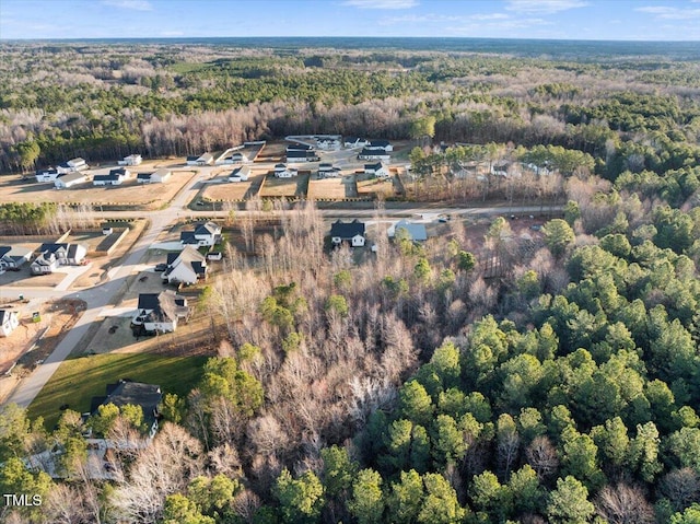 drone / aerial view with a view of trees