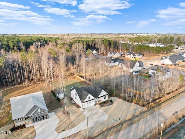 bird's eye view featuring a wooded view