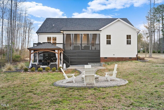 rear view of house with crawl space, a yard, a patio, and a gazebo