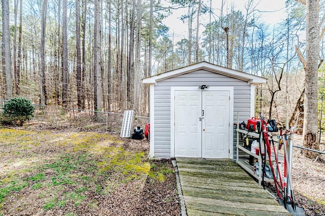 view of shed with fence