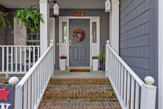 doorway to property featuring a porch