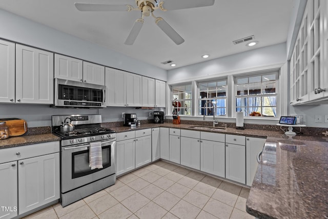 kitchen featuring appliances with stainless steel finishes, plenty of natural light, visible vents, and a sink