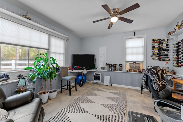 home office with ceiling fan and heating unit