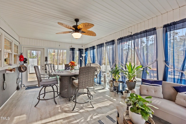 sunroom with a ceiling fan