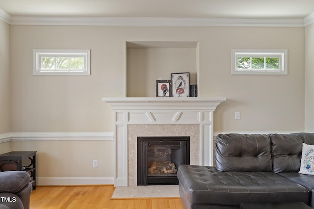 801 Myrtle Grove Ln, Apex, NC 27502 - living area with a fireplace with flush hearth, wood finished floors, ornamental molding, and a wealth of natural light