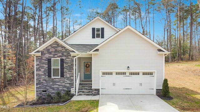 view of front of home featuring a shingled roof, a front yard, a garage, stone siding, and driveway