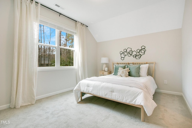 bedroom featuring visible vents, baseboards, carpet, and vaulted ceiling