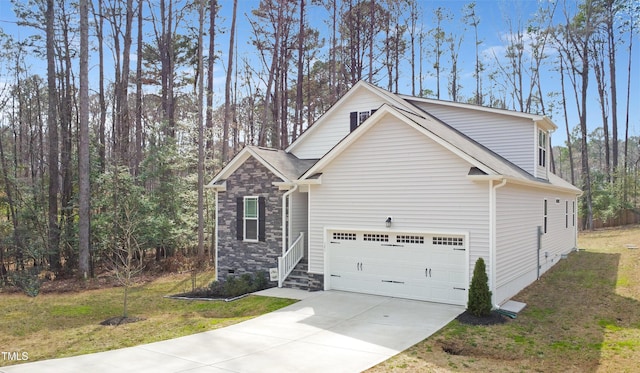 view of side of property with a shingled roof, a lawn, a garage, stone siding, and driveway