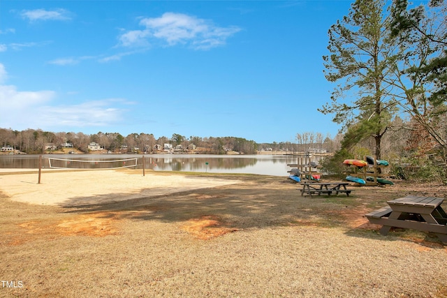 view of yard featuring volleyball court and a water view