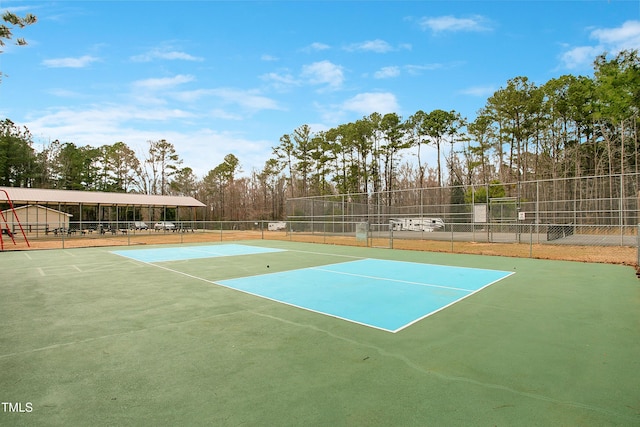 view of sport court featuring community basketball court and fence