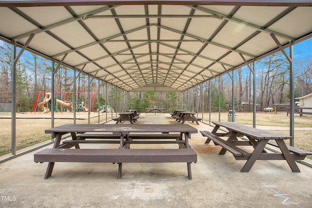 view of home's community featuring outdoor dining area and playground community