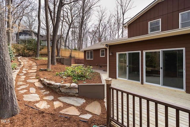 view of patio with a wooden deck and fence