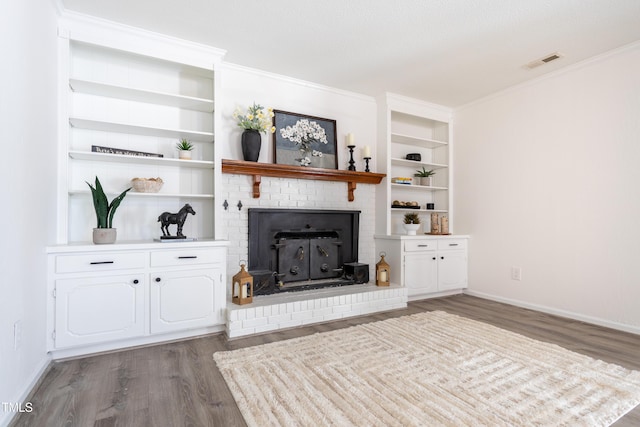 unfurnished living room with visible vents, crown molding, baseboards, and wood finished floors