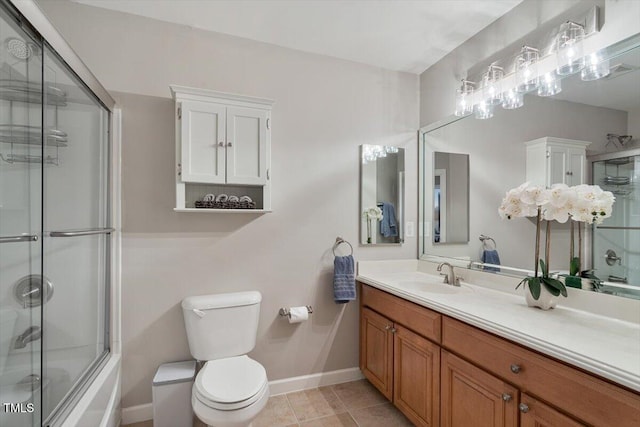 full bath with tile patterned flooring, baseboards, bath / shower combo with glass door, toilet, and vanity