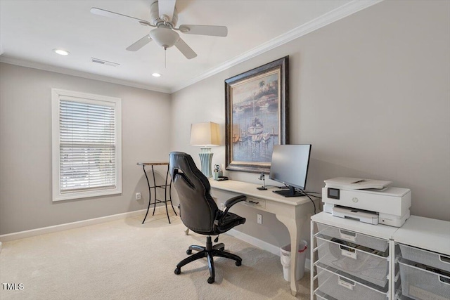 office featuring a ceiling fan, baseboards, visible vents, crown molding, and light colored carpet