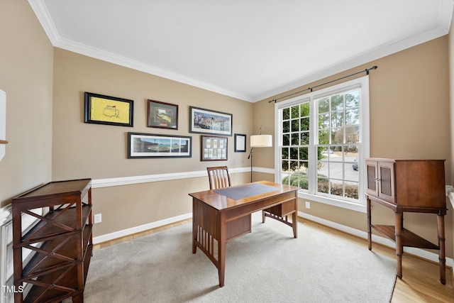 office area featuring baseboards, wood finished floors, and crown molding