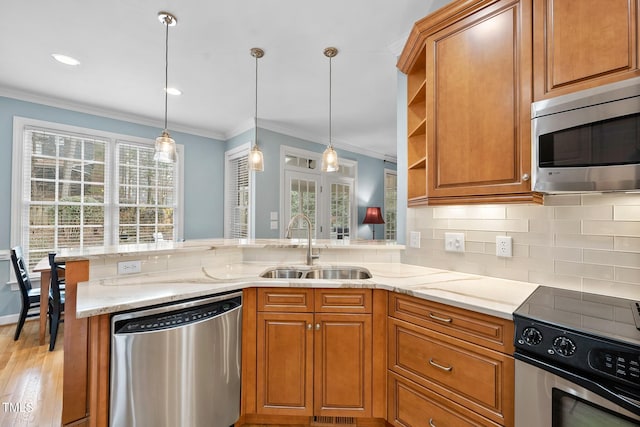 kitchen with a sink, brown cabinetry, tasteful backsplash, and stainless steel appliances