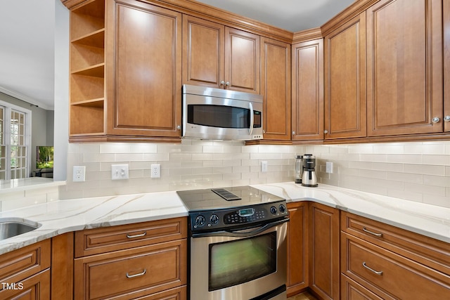 kitchen with brown cabinets and appliances with stainless steel finishes