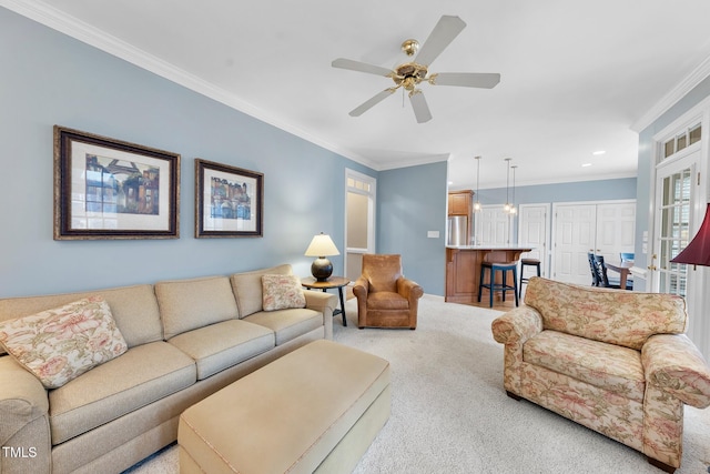 carpeted living room featuring recessed lighting, a ceiling fan, and ornamental molding