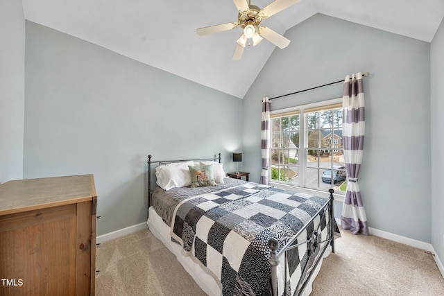 carpeted bedroom with vaulted ceiling, a ceiling fan, and baseboards