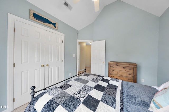 carpeted bedroom with visible vents, high vaulted ceiling, a closet, and a ceiling fan