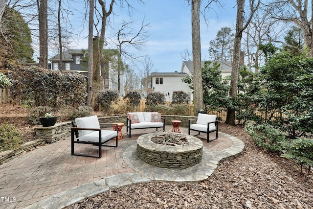 view of patio / terrace featuring an outdoor living space with a fire pit