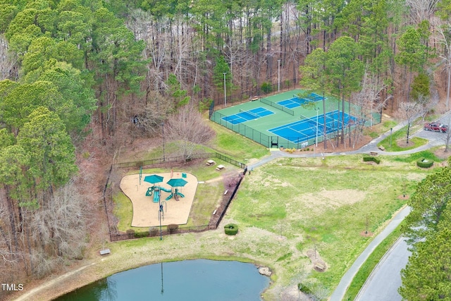 aerial view featuring a view of trees and a water view